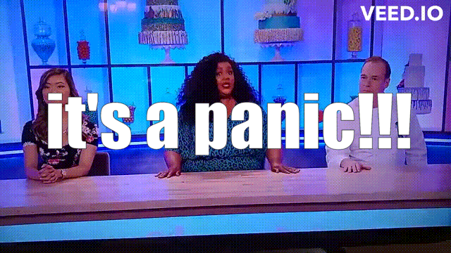 Nicole Byer at the judge's table for Nailed It, yelling, "It's a panic!" The other judges run out from behind the table; Nicole rolls over it.