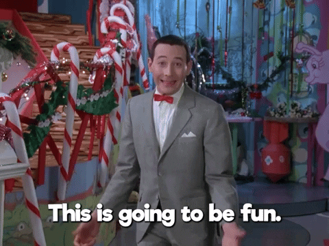 Pee Wee Herman, a man in a grey suit and red bowtie, saying, "This is going to be fun."