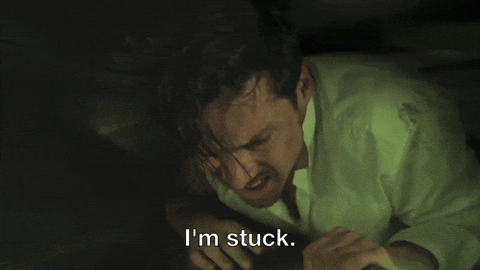 Gif of a man in a hole, words: I'm stuck