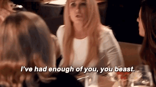 A gif of Kim Richards, Real Housewife of Beverly Hills, yelling "I've had enough of you, you beast" across a dinner table.