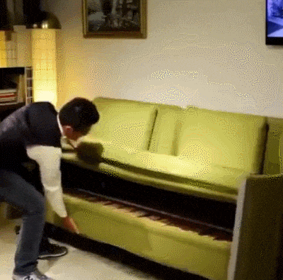 gif of folding yellow sofa, two story