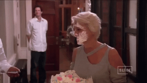 A gif of Dorinda Medley from Real Housewives of New York shoving her face into a birthday cake.